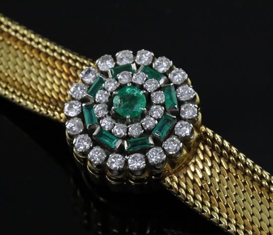 A ladys 18ct gold Jaeger Le Coultre 18ct gold, emerald and diamond set cocktail bracelet watch, overall length 17.2cm.